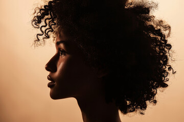 A woman with curly hair is shown in profile