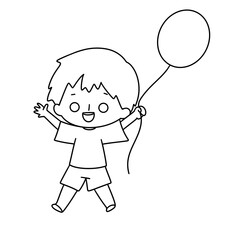 A boy is holding a balloon and smiling