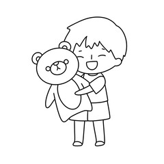 A boy is holding a teddy bear