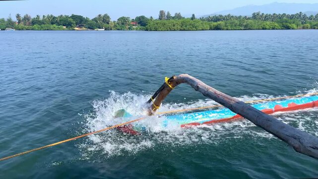 Close up shot of fast moving oar of traditional fishing boat Goa India 4K