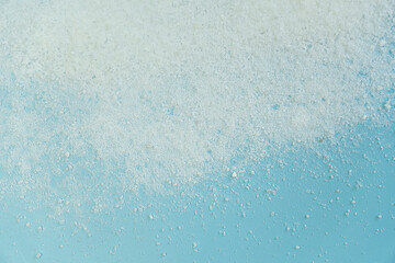 sea salt on blue background top view