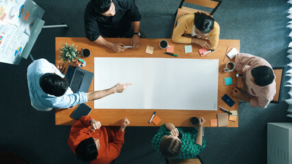 Top view of diverse group walking at boardroom and brainstorming idea. Smart startup team sharing...