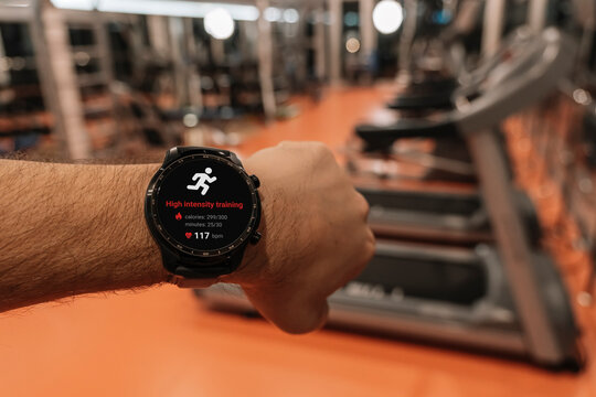 Running man with smart watch. Concept of The technology to check health while exercising. high-intensity training with an app on smart watch. the concept of a sporty lifestyle.