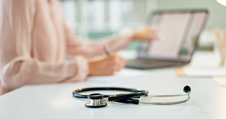 Healthcare, table and closeup of stethoscope in hospital for cardiology, lungs examination and breathing test. Medicine, medical tool and listening equipment on office desk in clinic for heart health