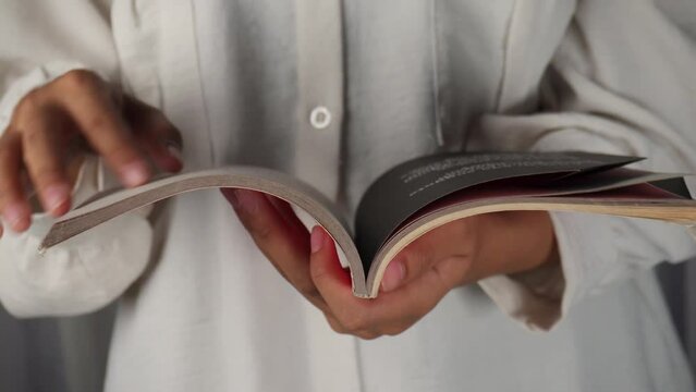 close up reading book while standing