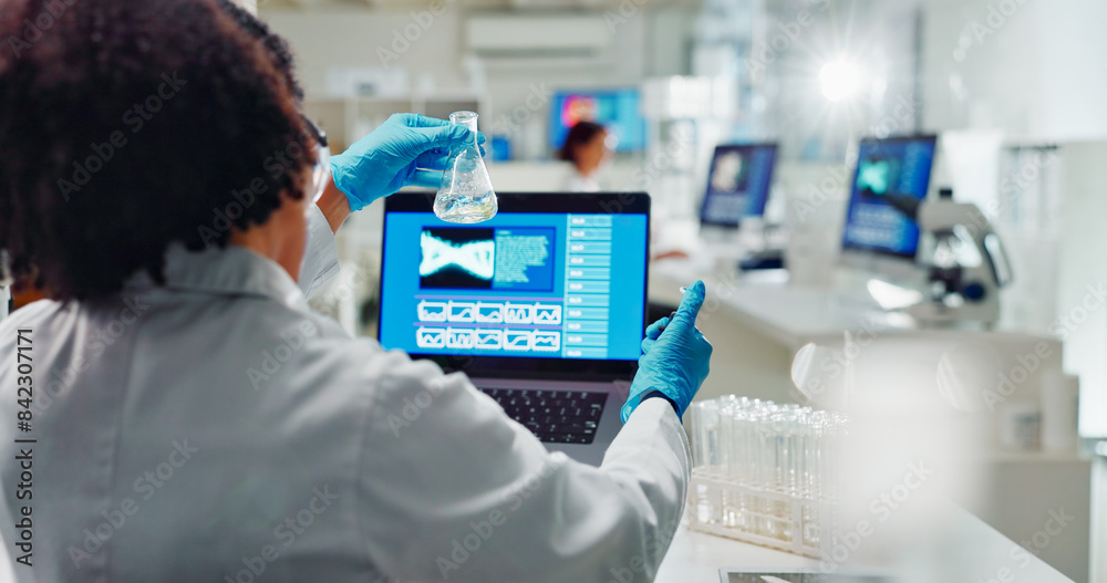 Wall mural Lab, back and woman for science research, bio technology and gene mutation with laptop for data analysis. Bioinformatics, innovation study and beaker with chemical, life expansion and development