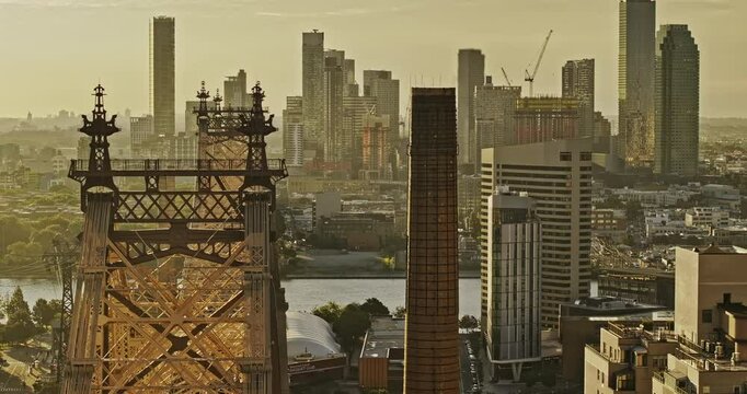 NYC New York Aerial v384 zoomed flyover landmark Queensboro bridge over East river capturing cityscape of Long Island City at Queens borough at sunrise - Shot with Mavic 3 Pro Cine - September 2023