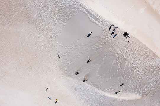 Aerial view of Lancelin sand dunes with tourists sandboarding, Western Australia