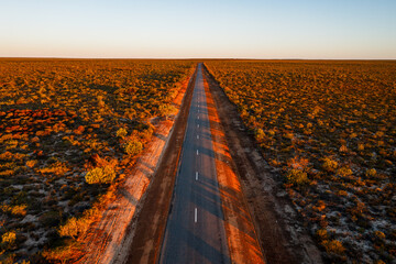 Aerial view of road in the outback at sunset, Western Australia