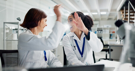 Women, high five and laptop in lab for science, notification or celebration for research project....
