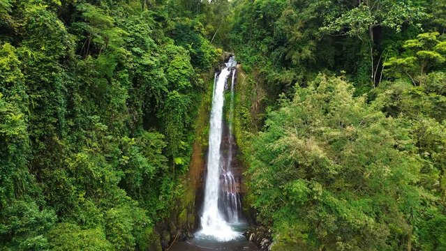 Aerial view of Gitgit waterfall with Balinese gate, Buleleng, Bali, Indonesia