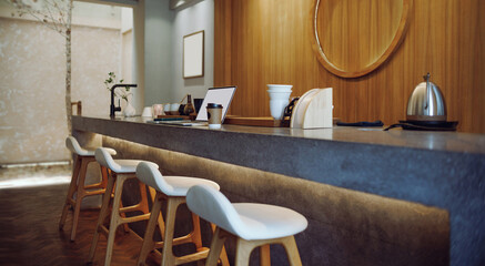 Comfortable workplace on counter bar and seat in cafe with computer laptop, mobile put on note book, coffee cup and coffee making equipment in background, taking a break after work concept