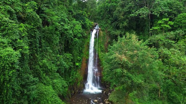 Aerial view of Gitgit waterfall with Balinese gate, Buleleng, Bali, Indonesia