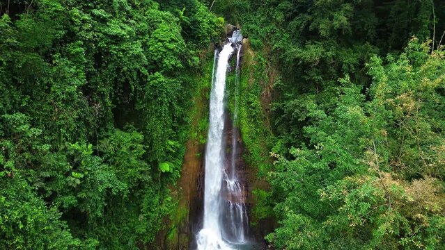 Aerial view of Gitgit waterfall with Balinese gate, Buleleng, Bali, Indonesia