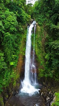 Aerial view of Gitgit waterfall with Balinese gate, Buleleng, Bali, Indonesia