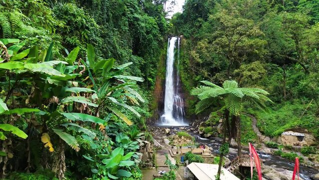 Aerial view of Gitgit waterfall with Balinese gate, Buleleng, Bali, Indonesia