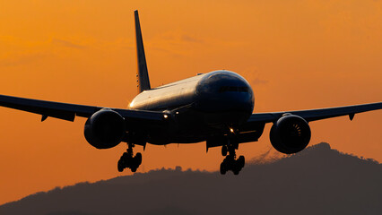 Airplane landing in costa rica during sunset