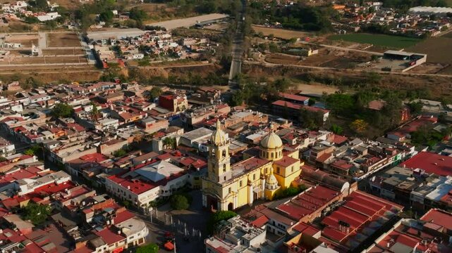 Santuario Diosesano Church in Tamazula. Aerial dolly out reveals scenic rural mountainous background