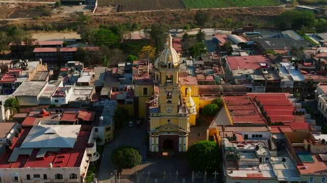 Up close aerial orbit left to right of Santuario Diosesano's facade in Tamazula. Jalisco, Mexico