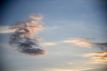 view of the blue sky at sunset with pink clouds