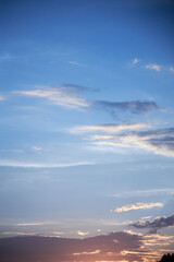 view of the blue sky at sunset with pink clouds
