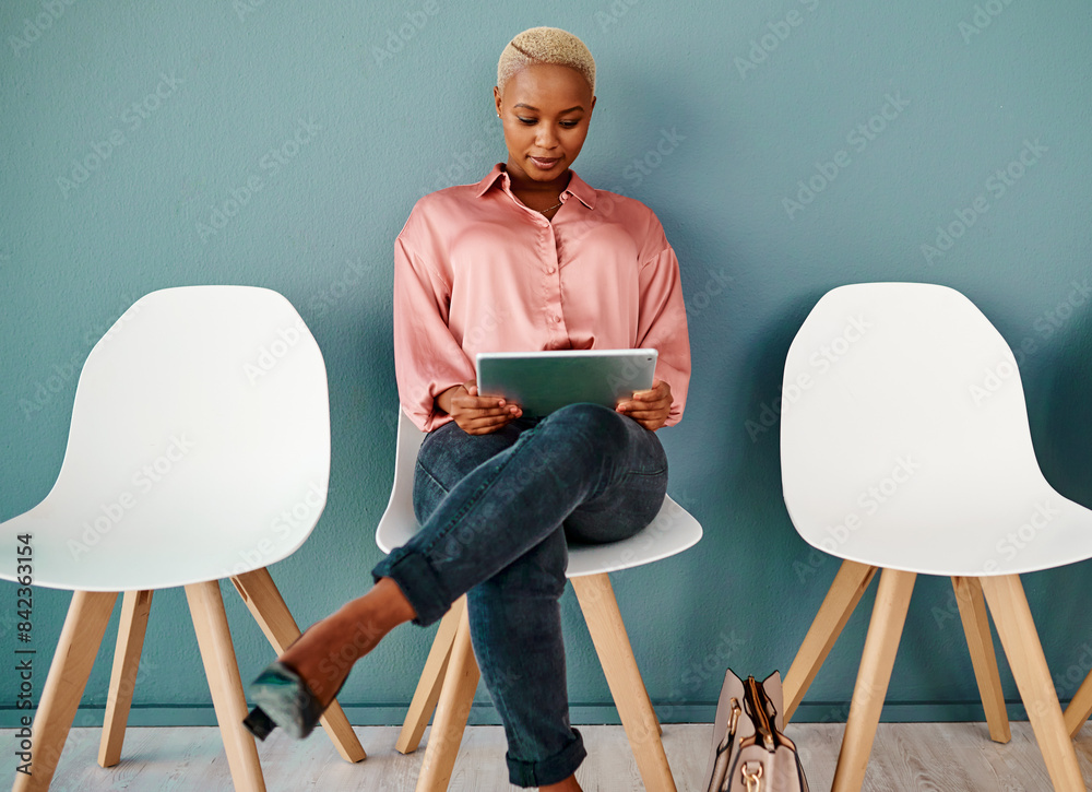 Canvas Prints Woman, chairs in waiting room and wall background, row of seats and tablet for appointment. Hire, business opportunity and recruitment in modern office workplace for interview with human resources