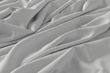 Obraz premium A detailed close-up shot of grey fabric with soft folds and creases, creating a textured and elegant background.