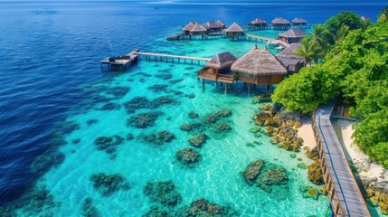 Tropical aerial landscape, seascape with long jetty, water villas with amazing sea and lagoon beach, tropical nature.