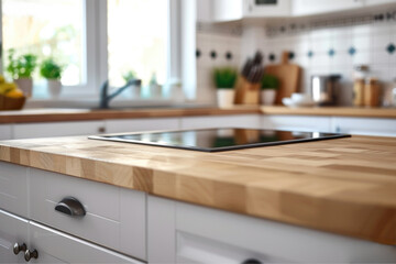 A kitchen counter with a tablet placed on it, suitable for use in tutorials, recipes, and other educational settings