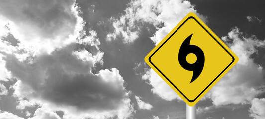 Hurricane season with symbol sign against a stormy background and copy space. dirty and angled sign adds to the drama. hurricane sign, hurricane season sing on cloudy background