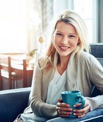 Woman, portrait and smile with coffee in living room on sofa for relax on weekend with home. Happy,...