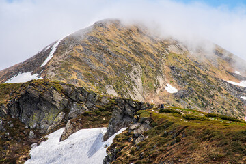 Landscape with Mount Hoverla hanging peak of the Ukrainian Carpathians against the background of the sky and clouds