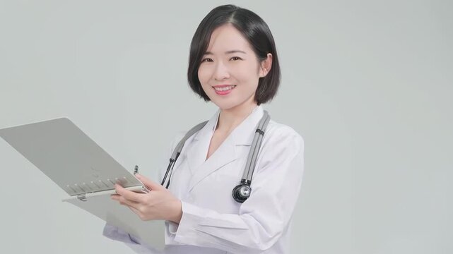 Therapist, Female doctor Pharmacist nurse Smiling wear white uniform with a folder standing in hospital office