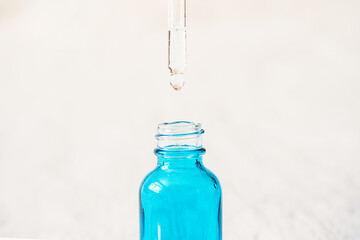 Essential oil in a glass bottle with pipette.