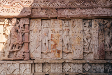 Ancient architectural stone carvings of Mandakini Temple with intricate artistry and historical importance
