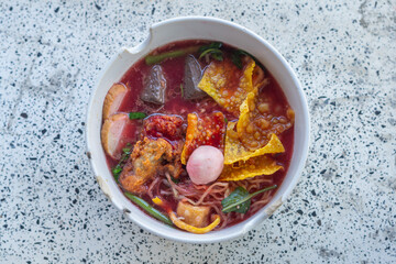 Large Yen Ta Fo Noodles on the Dining Table for Lunch. Large Noodles in Pink Soup