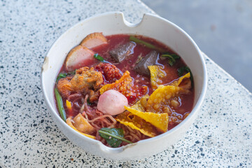 Large Yen Ta Fo Noodles on the Dining Table for Lunch. Large Noodles in Pink Soup