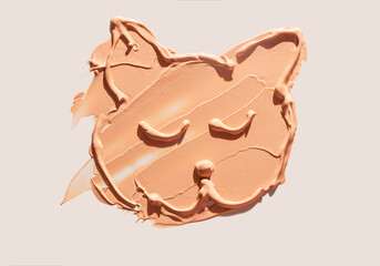 Make up smear foundation cat shaped smudge texture beige isolated background