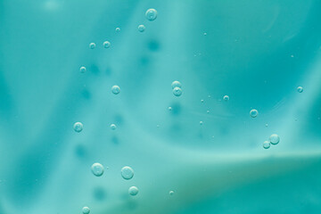 Cosmetic moisturizing texture background toner tonic or gel blue green background