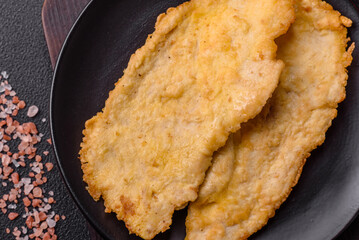 Delicious juicy chicken chops in batter with salt, spices and herbs