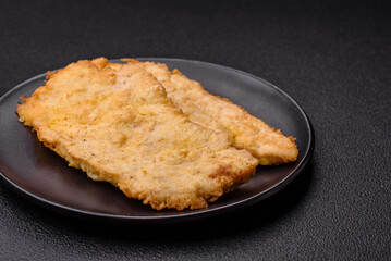 Delicious juicy chicken chops in batter with salt, spices and herbs