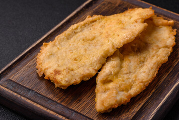 Delicious juicy chicken chops in batter with salt, spices and herbs