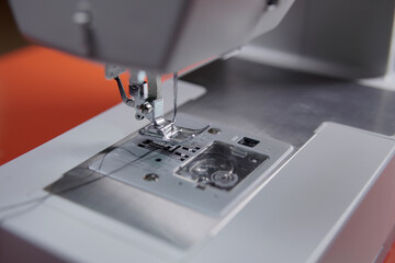 detail of sewing machine needle