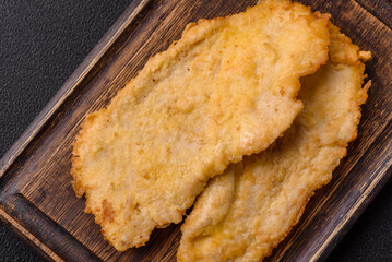 Delicious juicy chicken chops in batter with salt, spices and herbs
