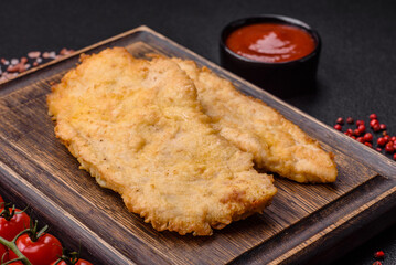 Delicious juicy chicken chops in batter with salt, spices and herbs