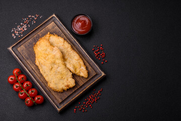 Delicious juicy chicken chops in batter with salt, spices and herbs
