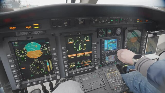 Witness the detailed instrumentation and controls of the helicopter's dashboard in a close-up shot as the pilot meticulously prepares for takeoff, ensuring everything is in order for flight.
