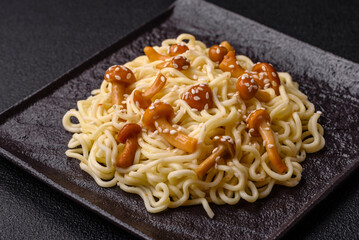 Delicious Asian cuisine dish with rice noodles, peppers, mushrooms and spices