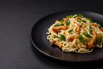 Delicious Asian cuisine dish with rice noodles, peppers, mushrooms and spices