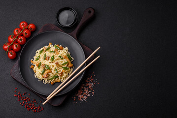 Delicious Asian cuisine dish with rice noodles, peppers, mushrooms and spices